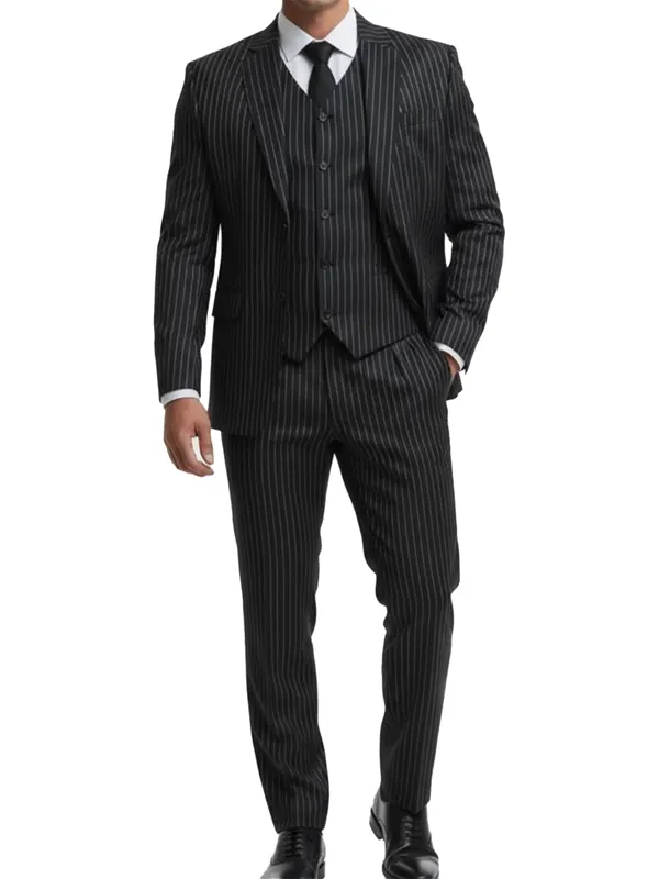 A man wearing a tailored black suit with fine white pinstripes, featuring a modern fit and notched lapels.