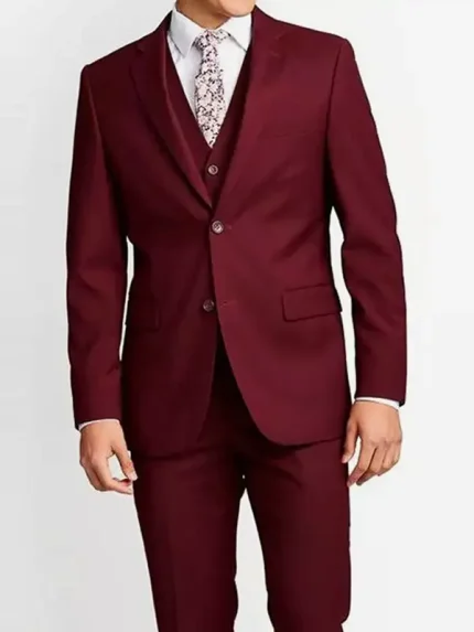 Front view of a men’s maroon suit with vest, featuring a buttoned blazer, matching waistcoat, and tailored trousers on a white background.