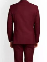 Back view of a men’s slim fit maroon 3 piece suit showing the tailored blazer fit and matching trousers on a white background.