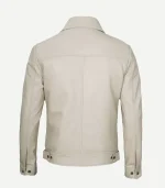 Rear view of a slim-fit beige leather jacket featuring a clean yoke, vertical center seam, adjustable waist tabs with buttons, and a classic pointed collar.