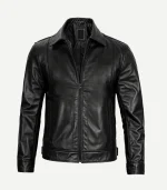 Front view of a sleek black leather jacket featuring a classic pointed collar, full-zip closure, vertical side pockets, and a tailored, contemporary fit.