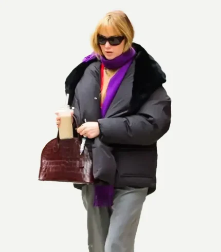 A sleek black Jennifer Lawrence Puffer Coat with a high collar and deep pockets for a versatile winter look.