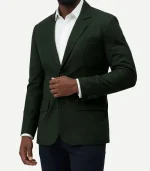 Mens Dark Green Suede Leather Blazer with detailed notch lapels and high-quality stitching on a deep green surface.