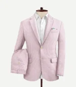 A Pink Seersucker Style Suit with a matching jacket and pants featuring a soft pink color and puckered fabric.