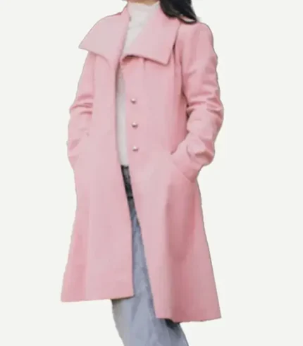 A woman walking outdoors wearing a Pink Wool Trench Coat over a neutral outfit.