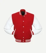 A centered front view of a red varsity jacket with white leather sleeves. The jacket features white snap-button closures and two front pockets with white leather trim. The ribbed collar, cuffs, and waistband are red with two white horizontal stripes.
