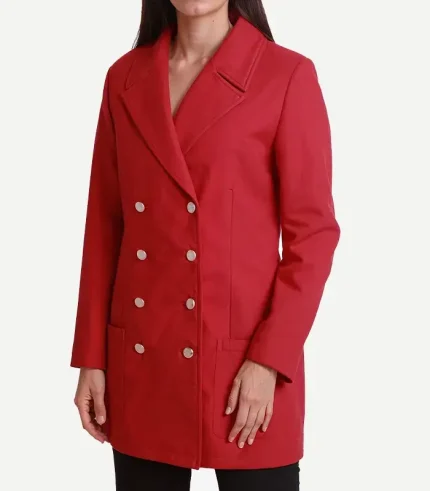 A model posing in a Womens Double Breasted Red Wool Coat with a classic collar and deep pockets.