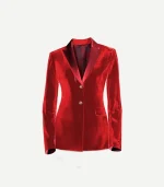 A close-up front view of a women's red cotton velvet tuxedo jacket. The jacket features contrasting satin peak lapels, a single chest welt pocket, and two flap pockets at the hips. Two ornate gold buttons are visible at the center closure, and the dark patterned interior lining is slightly visible at the neck.
