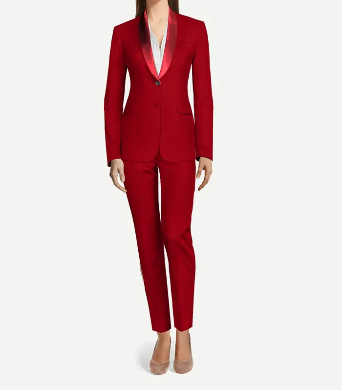 Womens Red Velvet Tuxedo With Shawl Lapel A full-length front view of a woman wearing a monochrome red velvet tuxedo. The jacket features a rounded red satin shawl lapel and a single-button closure, paired with matching slim-fit trousers.