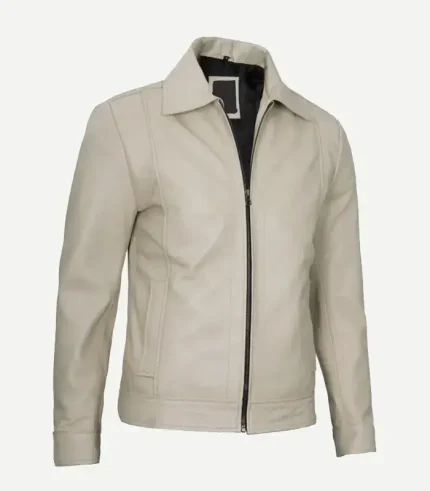 Side-angled view of a neutral beige leather jacket highlighting the smooth grain texture, silver hardware, vertical stitching, and comfortable, stylish fit.
