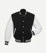 A front-angled view of a classic varsity jacket with a black wool body and white leather sleeves. The jacket features a ribbed stand-up collar, white snap-button closures, and two slanted front pockets with white trim. The cuffs and waistband are black with two horizontal white stripes.