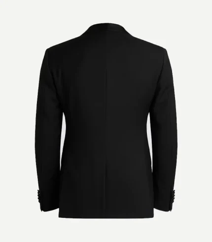 Back of a black slim-fit tuxedo jacket showing a structured, tailored waist and a clean single-vent design. Finished with four buttons on each sleeve cuff.