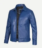 Angled three-quarter view of an open blue leather jacket with side slit pockets, structured shoulders, and a smooth, semi-matte finish.