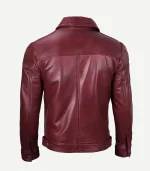 Rear view of a maroon leather jacket highlighting a clean back yoke, central vertical seam, and adjustable button-tab waistband.