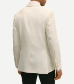Rear view of the slim-fit white dinner jacket showing dual side vents and a more tailored, narrow cut through the shoulders and back. The sleeves are more tapered, finishing with four-button cuffs.