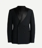 A tailored-fit black double-breasted dinner jacket with wide satin peak lapels and a traditional four-button arrangement. It features formal jetted pockets.