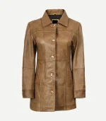 Front view of a buttoned camel brown leather car coat for women. It features a shirt-style collar, vertical welt pockets, and a refined, slim-fit silhouette.