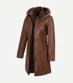 Three-quarter angled view of the brown leather coat showcasing its slim-fit silhouette, smooth leather texture, and voluminous faux-fur hood trim.