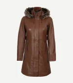 Front view of the brown leather coat with the storm flap partially open, revealing the internal zipper, snap buttons, and side-entry zipper pockets.