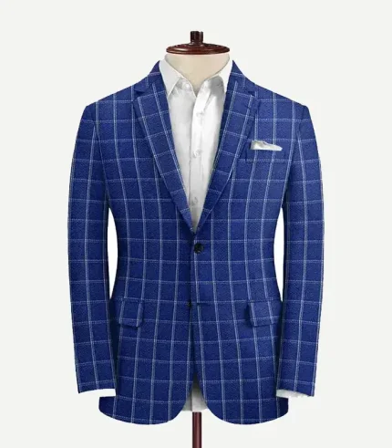 Studio macro display of the blue checked seersucker style suit jacket on a mannequin, highlighting the detailed puckered texture, notch lapel, and windowpane pattern.