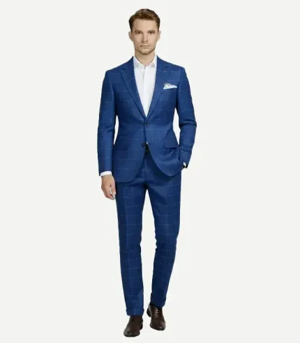 Full-body studio shot of a male model wearing a premium blue checked seersucker style suit, paired with a crisp white button-down shirt.