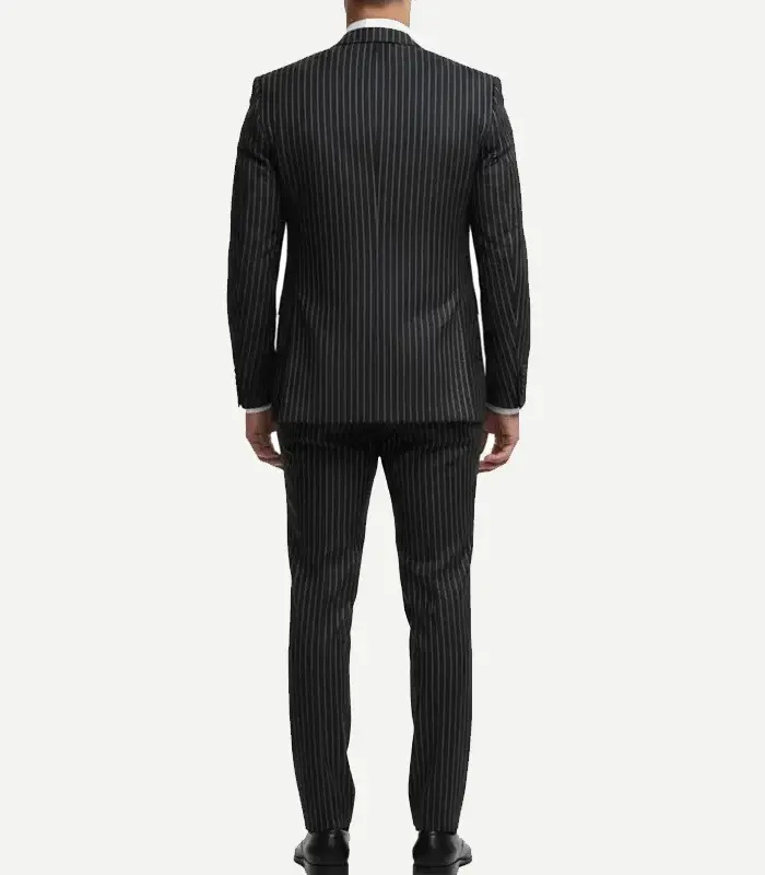 Rear view of a man wearing a black or dark grey pinstripe suit jacket and matching trousers against a plain white background.
