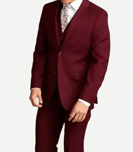 A mid-section front product shot of a man wearing a slim-fit maroon three-piece suit, showing the matching two-button jacket, tailored vest, and flat-front formal trousers.