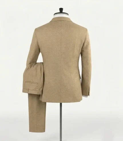 Rear view of the men's spring latte tortilla brown tuxedo suit on a mannequin, showcasing the structured shoulders and clean back drape of the jacket.